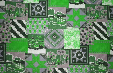 Zielona patchworkowa tkanina.